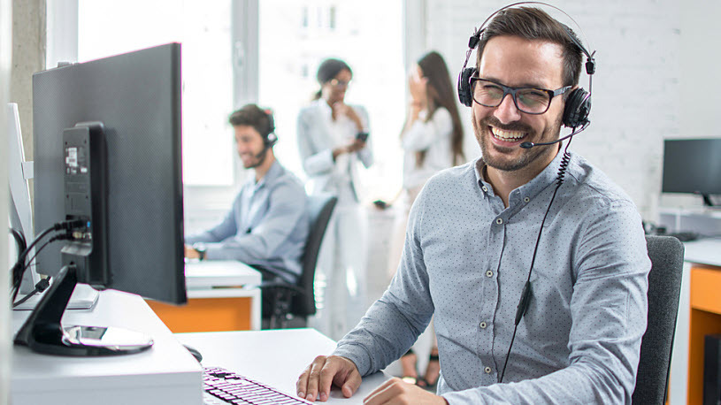Generative AI for HR hero image Happy male call center employee