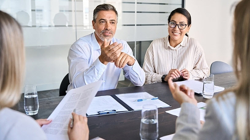 Diverse professional executive team meeting in the office. Diverse professional executive team meeting in the office.
