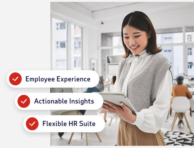 Employee on tablet behind ADP Workforce Now differentiators text